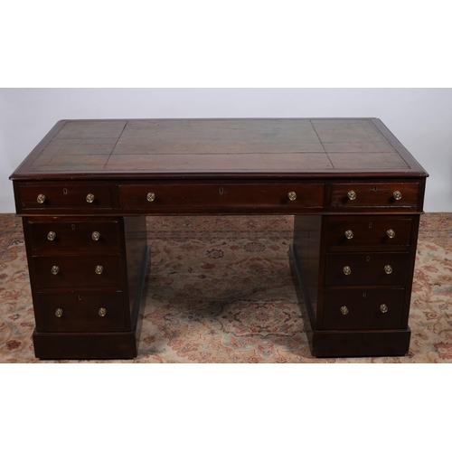 70 - A 19TH CENTURY MAHOGANY PEDESTAL DESK of rectangular outline the shaped top with tooled leather inse... 