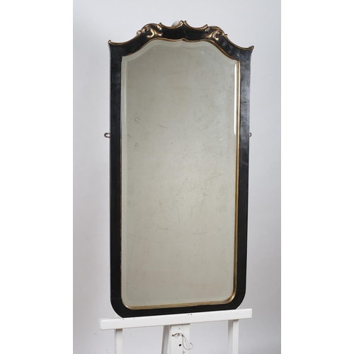 717 - A CONTINENTAL GILT FRAME MIRROR the shaped bevelled glass plate within a moulded frame with foliate ... 