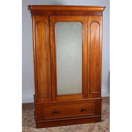 72 - A 19TH CENTURY MAHOGANY WARDROBE the moulded cornice above a mirrored door containing hanging rail a... 