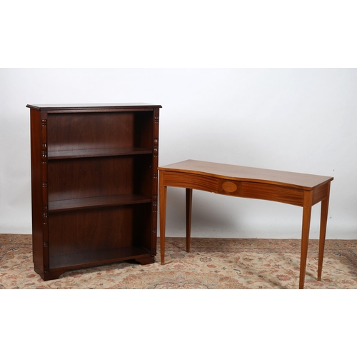 731 - A SHERATON DESIGN MAHOGANY CONSOLE TABLE of serpentine outline the shaped top with inlaid frieze on ... 