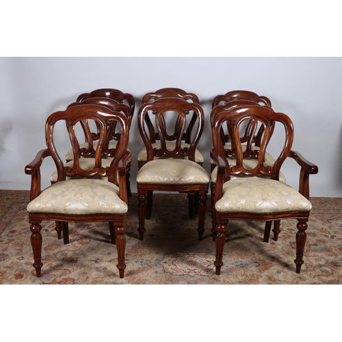 74 - AN ELEVEN PIECE VICTORIAN DESIGN MAHOGANY DINING ROOM SUITE comprising ten chairs, including a pair ... 