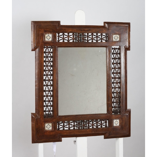 743 - A BURMESE HARDWOOD FRAME MIRROR the rectangular plate within a pierced bobbin turned marginal frame ... 