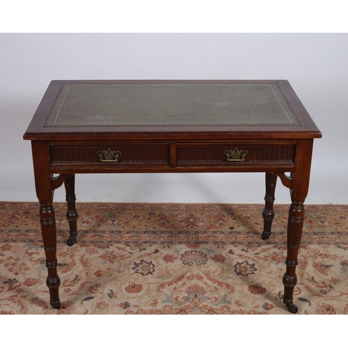 76 - A VINTAGE MAHOGANY WRITING TABLE of rectangular outline the shaped top with tooled leather inset abo... 