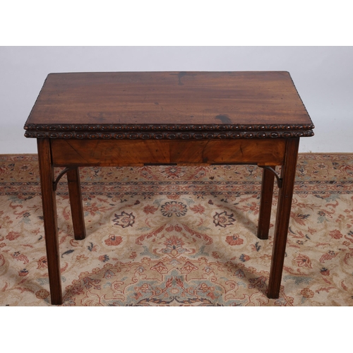 77 - A 19TH CENTURY MAHOGANY FOLDOVER SUPPER TABLE of rectangular outline the hinged top with gadrooned r... 