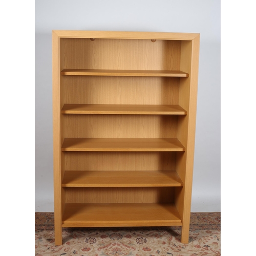 807 - A BEECHWOOD OPEN FRONT CABINET of rectangular outline the shaped top above four shelves, three adjus... 