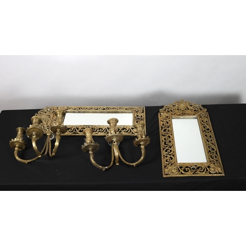 866 - A PAIR OF GILT BRASS MIRRORS each with a pierced foliate frame with figural cresting
61cm (h) x 28cm... 