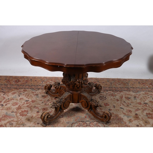 875 - A CONTINENTAL STAINED BEECHWOOD POD TABLE the shaped moulded top above a carved and fluted column on... 