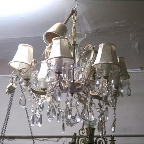 876 - A BOHEMIAN CUT GLASS SIX BRANCH CHANDELIER with scroll arms hung with faceted pendants and chains