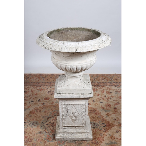 89 - A COMPOSITION STONE URN AND PEDESTAL of semi lobed campana form raised on a square pedestal with bea... 