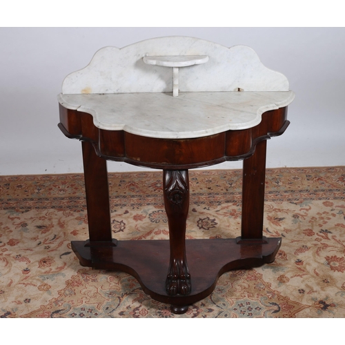 91 - A 19TH CENTURY MAHOGANY WASH STAND of demi lune outline the shaped white veined marble top above a m... 