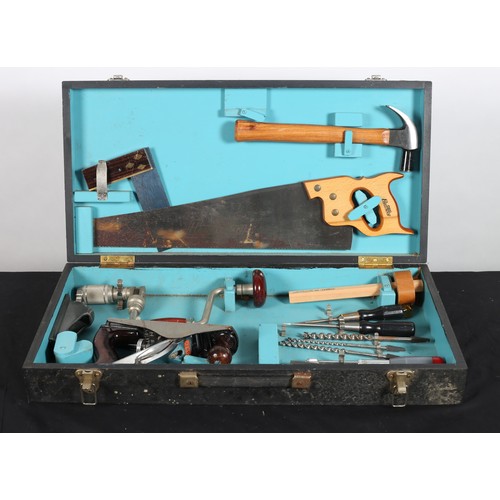 810 - A WOODWORKERS TOOLBOX containing saw, hammer, plane, chisels, etc. in a pine black painted case with... 