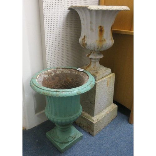 831 - A 19TH CENTURY CAST IRON URN ON PEDESTAL of semi lobed campana form raised on a square stepped pedes... 