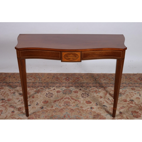 71 - A SHERATON DESIGN MAHOGANY AND SATINWOOD INLAID CONSOLE TABLE of serpentine outline the shaped top r... 