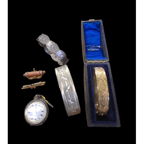 507 - A COLLECTION OF JEWELLERY to include a silver fob watch, a silver plated bangle, a silver plated ban... 