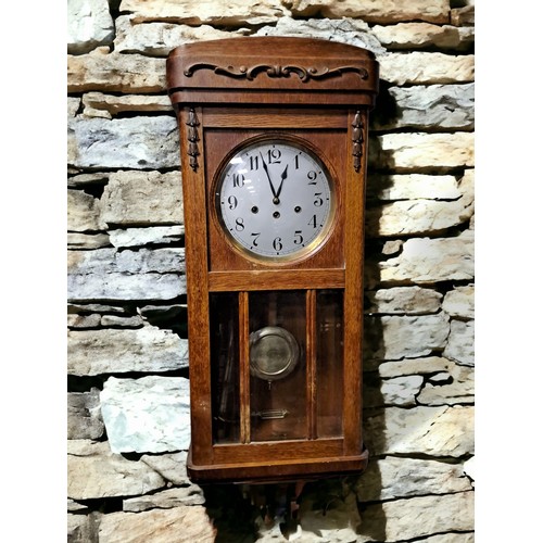 829 - A VINTAGE OAK WALL CLOCK the rectangular case with applied carving with circular silver dial and bra... 