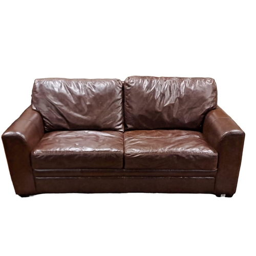 73 - A DESIGNER BROWN HIDE UPHOLSTERED TWO SEATER SETTEE of rectangular outline with loose cushions and s... 