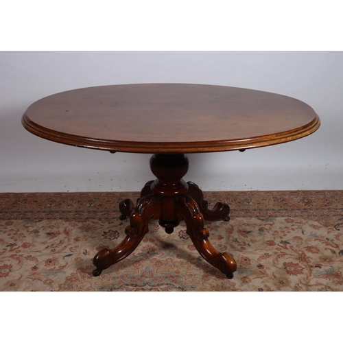 84 - A 19TH CENTURY POD TABLE of oval outline the shaped top above a baluster column on quadruped splayed... 