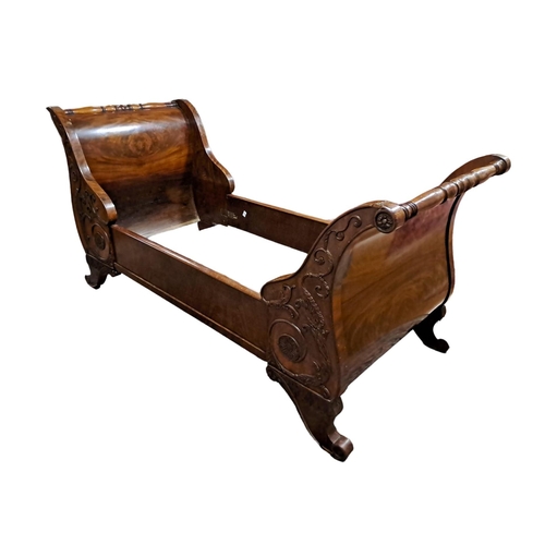 85 - A 19TH CENTURY MAHOGANY LIT BATEAU BED FRAME the arched headboard with baluster stretcher and confor... 