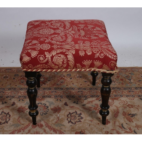 89 - A VICTORIAN DESIGN EBONISED PARCEL GILT AND UPHOLSTERED STOOL the rectangular upholstered seat raise... 