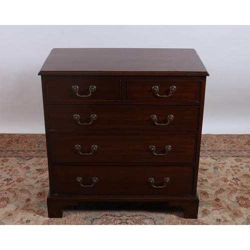 186 - A GEORGIAN MAHOGANY CHEST of rectangular outline the shaped top above two short and three long gradu... 