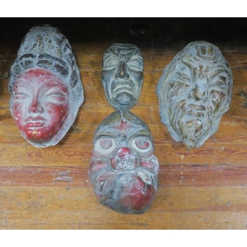 230 - THREE COMPOSITION STONE AND POLYCHROME MASKS together with a pine example (4)