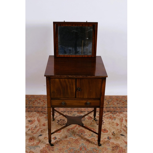 286 - A 19TH CENTURY MAHOGANY DRESSING STAND of rectangular outline the shaped top surmounted by a swivel ... 