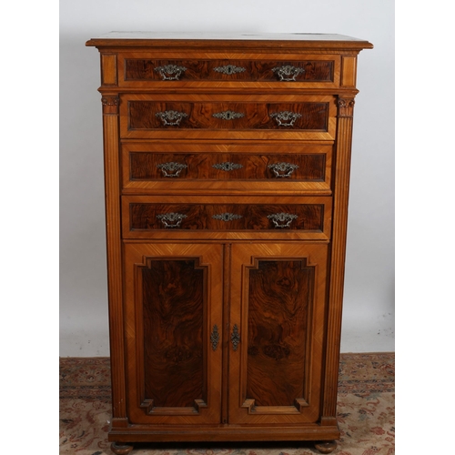 287 - A CONTINENTAL WALNUT TALLBOY of rectangular outline the shaped top above three long graduated drawer... 