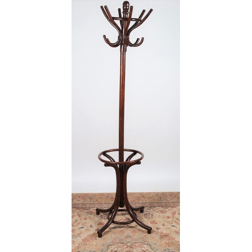 284 - A VINTAGE BENTWOOD HAT COAT AND STICK STAND of typical form with revolving top raised on quadruped s... 