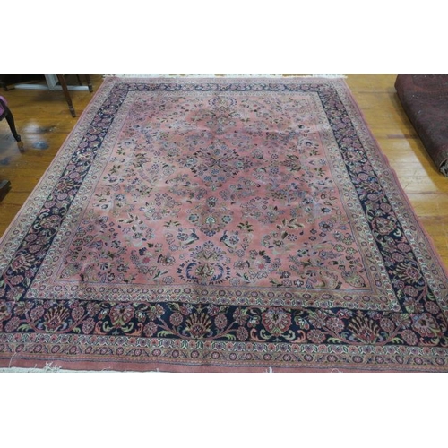 330 - A HERATI WOOL RUG the light pink and indigo ground with central panel filled with stylised flowerhea... 