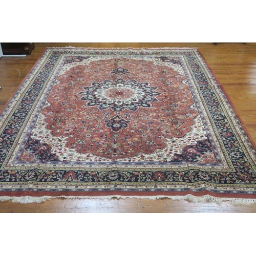 331 - A SAVOUK WOOL RUG the rust, indigo and beige ground with central panel filled with stylised flowerhe... 