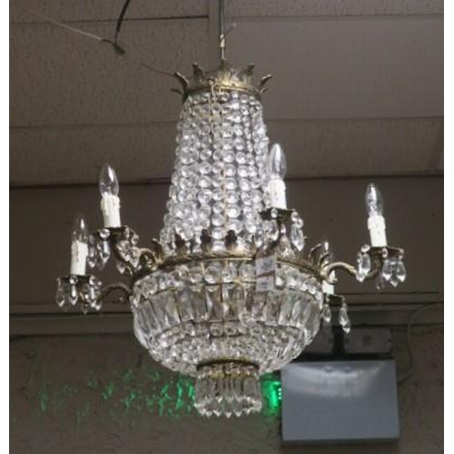 337 - A CONTINENTAL GILT BRASS AND CUT GLASS SIX BRANCH BASKET CHANDELIER hung with cascading pendant drop... 