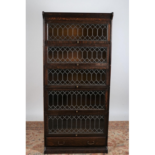 357 - A VINTAGE OAK AND LEAD GLASS BOOKCASE of rectangular outline the moulded cornice above five lead gla... 