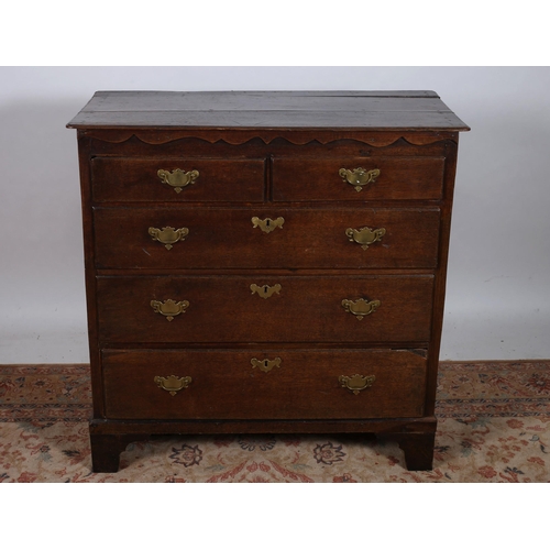 371 - A GEORGIAN OAK CHEST of rectangular outline the shaped top above two short and three long graduated ... 