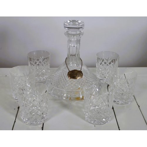 559 - A SET OF SIX DUBLIN CRYSTAL CUT GLASS TUMBLERS together with A CUT GLASS SHIP'S DECANTER with silver... 