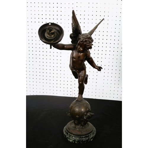 561 - after L'AMOUR VAGABOND
A bronze figural table lamp in the form of a winged cherub shown standing on ... 