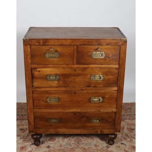 601 - A GEORGIAN DESIGN PINE MILITARY CHEST of rectangular outline the shaped top above two short and thre... 