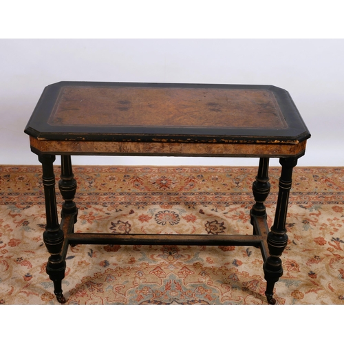 626 - A 19TH CENTURY BURR WALNUT AND EBONISED TABLE of rectangular outline with canted angles on dual ring... 