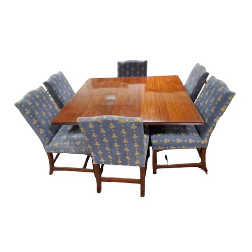 620 - A NINE PIECE MAHOGANY DINING ROOM SUITE comprising eight chairs each with a rectangular shaped uphol... 