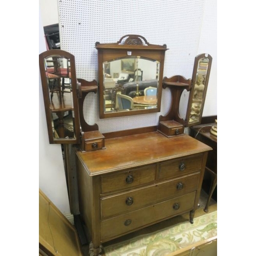 613 - A VINTAGE MAHOGANY DRESSING TABLE the superstructure with bevelled glass swivel mirrors the base wit... 