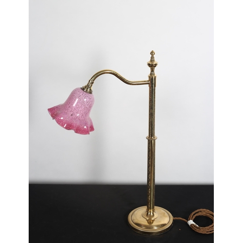 102 - A BRASS ENGRAVED TABLE LAMP the cylindrical column with shaped arm  above a circular spreading foot ... 