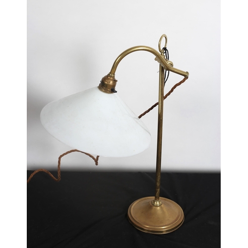 103 - A VINTAGE BRASS ADJUSTABLE READING LAMP the cylindrical column above a circular foot with opaline gl... 