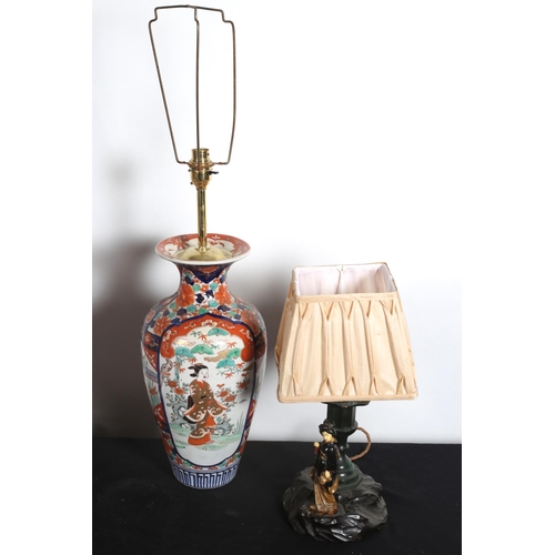 112 - AN IMARI DESIGN TABLE LAMP the white ground with figural and stylised flowerhead decoration 
73cm (h... 