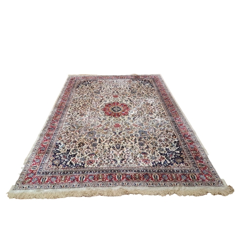 145 - A BEIGE GROUND PATTERN RUG the central floral panel within a conforming border 
327cm (l) x 233cm (w... 