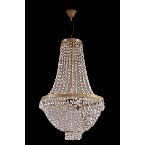 152 - A PAIR OF CONTINENTAL CUT GLASS AND GILT BRASS FOUR LIGHT CENTRE LIGHTS with cascading pendent drops... 