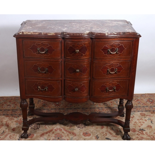 164 - A CONTINENTAL MAHOGANY WALNUT AND GILT BRASS INLAID CHEST of serpentine outline the shaped top with ... 