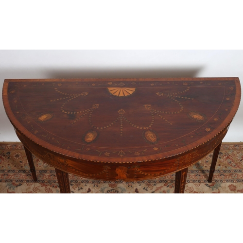 166 - A FINE GEORGIAN MAHOGANY INLAID SIDE TABLE of demi lune outline the shaped top with satinwood crossb... 