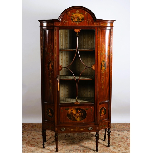 172 - A EDWARDIAN MAHOGANY AND POLYCHROME CHINA DISPLAY CABINET the rectangular arched pediment above a gl... 