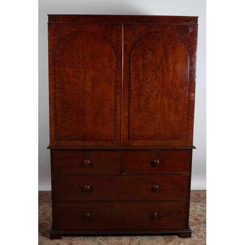 195 - A 19TH CENTURY MAHOGANY LINEN PRESS ON CHEST the moulded cornice above a pair of arched panel doors ... 