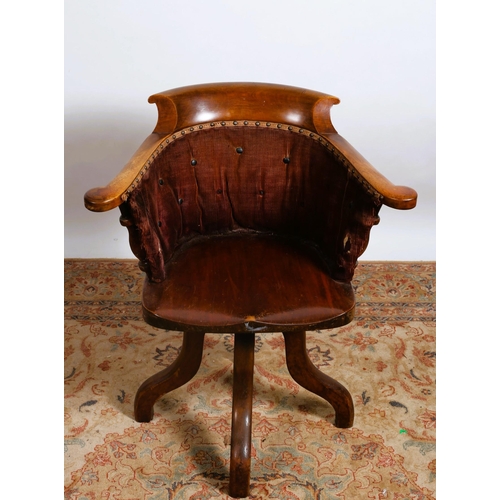 204 - A VINTAGE MAHOGANY AND UPHOLSTERED TUB SHAPED SWIVEL LIBRARY CHAIR the curved back with upholstered ... 