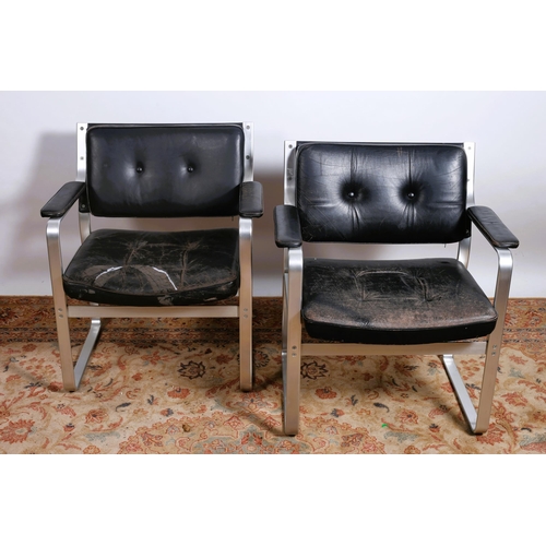 211 - A PAIR OF KARL EKSELIUS 'MONDO' BLACK LEATHER ARMCHAIRS  H 80cm x W68cm x D 64cm, Seat Height 45 cm ... 